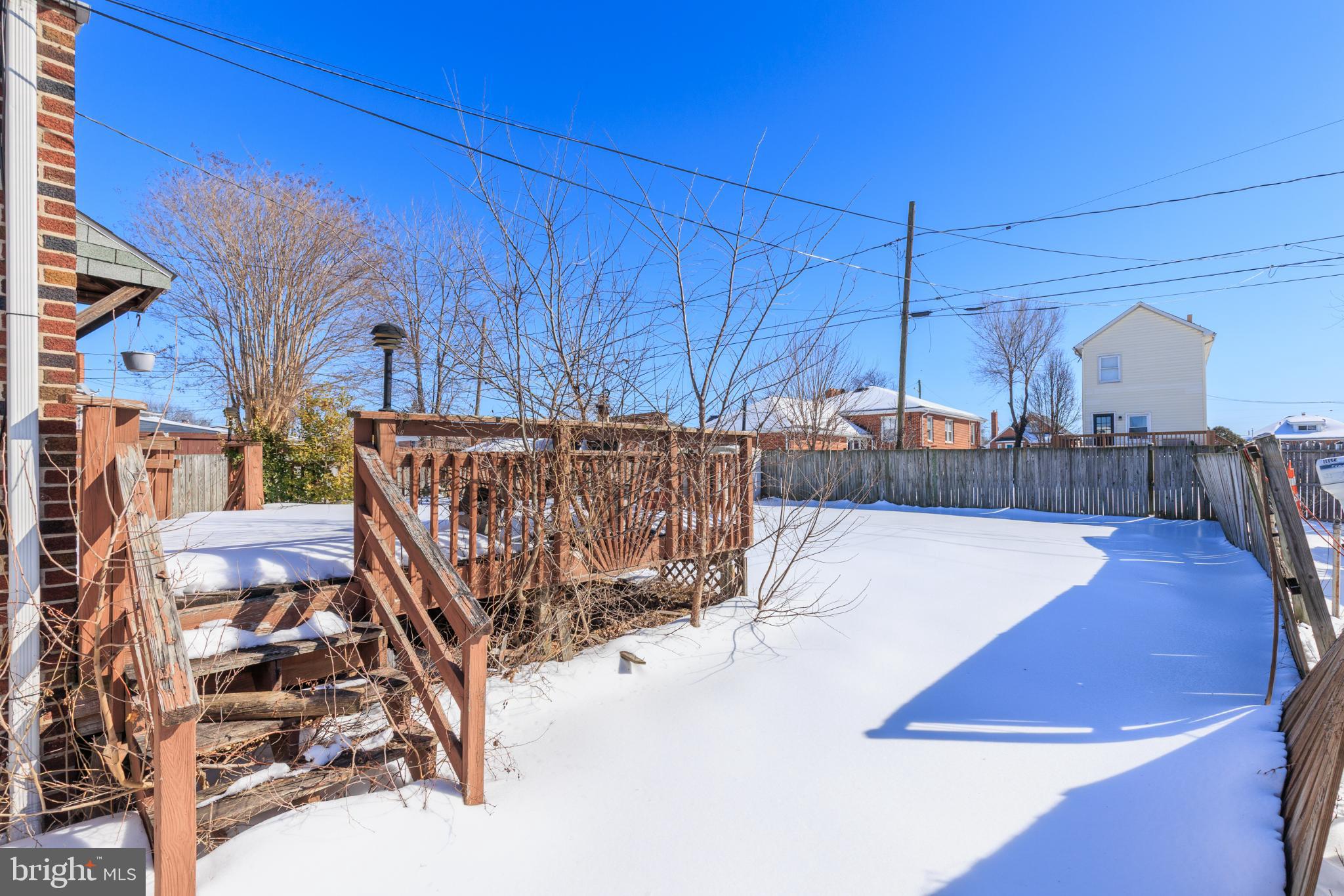 6627 Bushey Street Baltimore, MD 21224 - Photo 28 of 33 Sunny winter retreat with snow-covered yard.