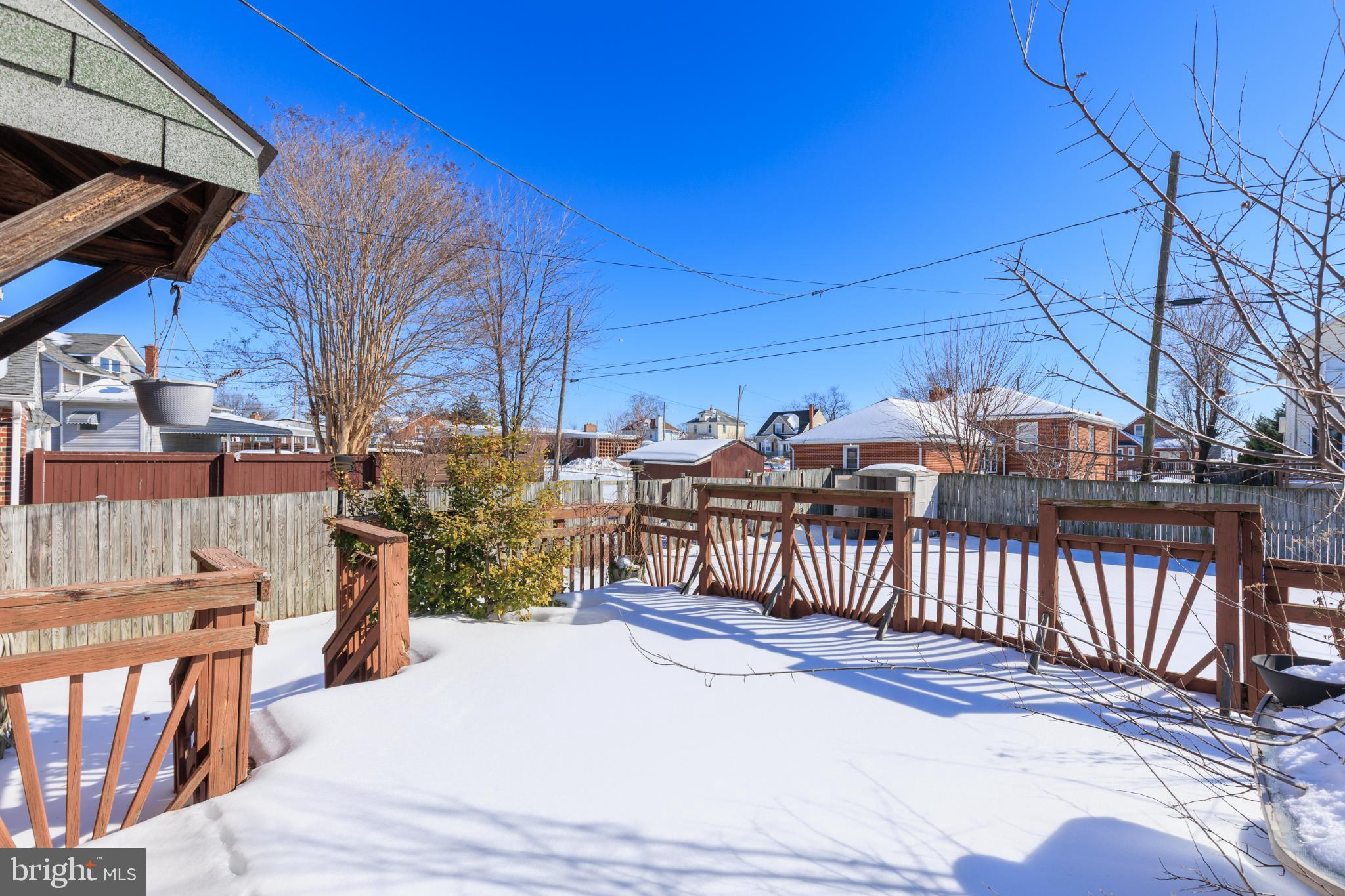 6627 Bushey Street Baltimore, MD 21224 - Photo 29 of 33 Sunny winter retreat with snow-covered deck.