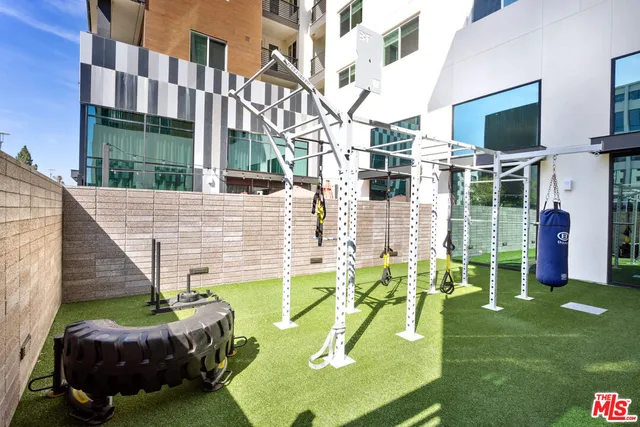 a view of a backyard with furniture and a garden