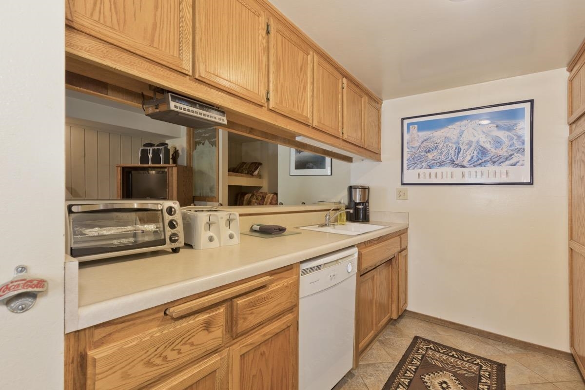 244 Lakeview Boulevard, Unit 149 Mammoth Lakes, CA 93546 - Photo 18 of 29 Kitchen featuring light countertops, dishwasher, and light tile patterned floors