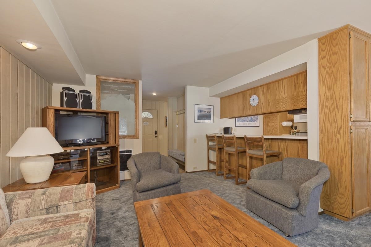244 Lakeview Boulevard, Unit 149 Mammoth Lakes, CA 93546 - Photo 2 of 29 Carpeted living area featuring recessed lighting and heating unit