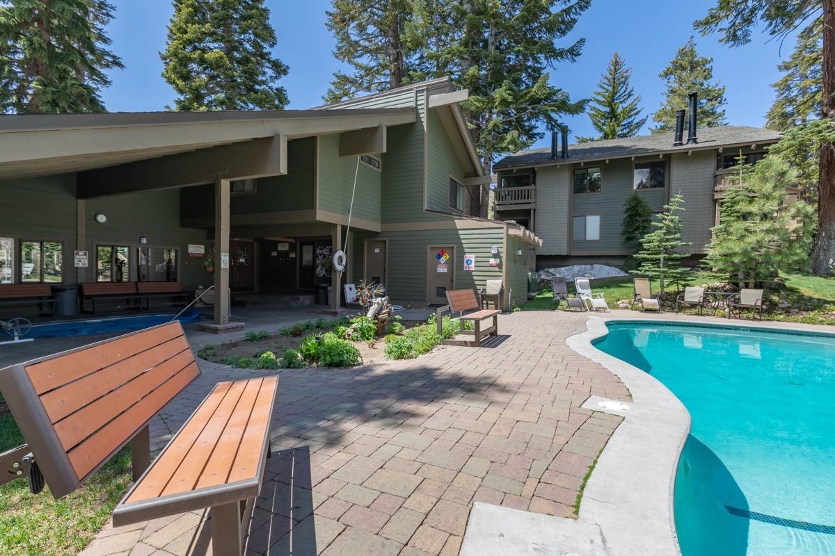 244 Lakeview Boulevard, Unit 149 Mammoth Lakes, CA 93546 - Photo 26 of 29 Back of property with an outdoor pool and a patio area