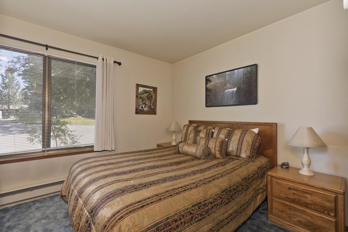 244 Lakeview Boulevard, Unit 149 Mammoth Lakes, CA 93546 - Photo 6 of 29 Bedroom featuring a baseboard heating unit and dark carpet