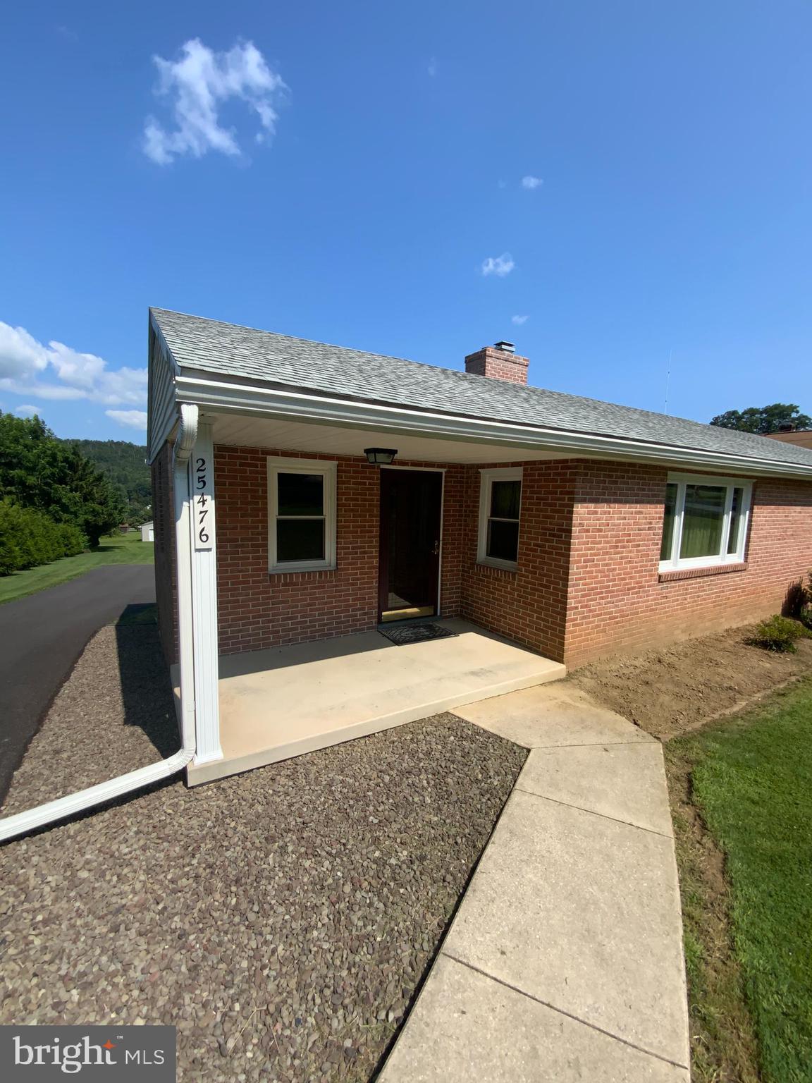 25476 Military Road Cascade, MD 21719 - Photo 2 of 30 a front view of a house with a yard