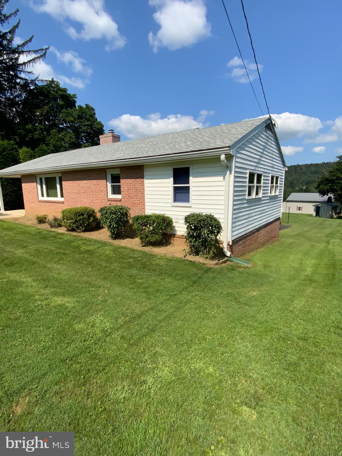 25476 Military Road Cascade, MD 21719 - Photo 4 of 30 a view of a house with a garden
