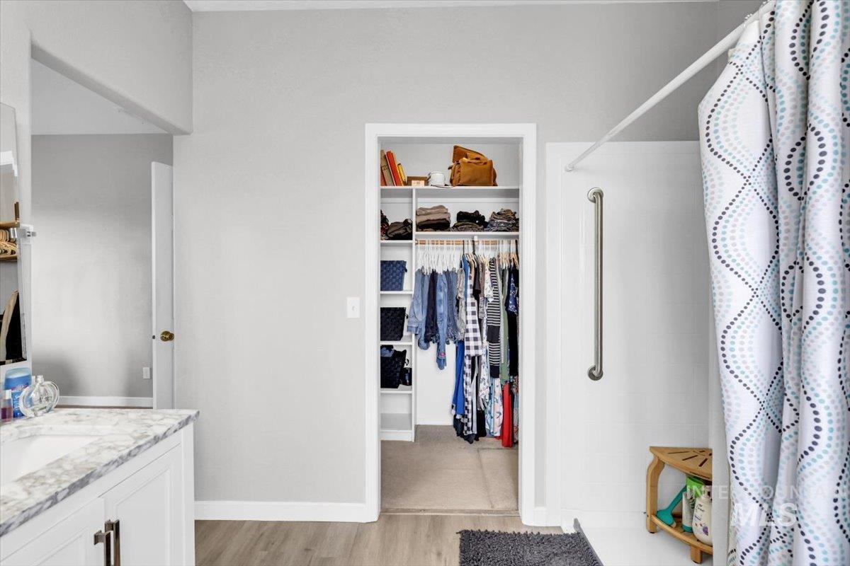 23919 Tyler Lane Middleton, ID 83644 - Photo 16 of 48 Walk in closet with light wood-style flooring and a sink