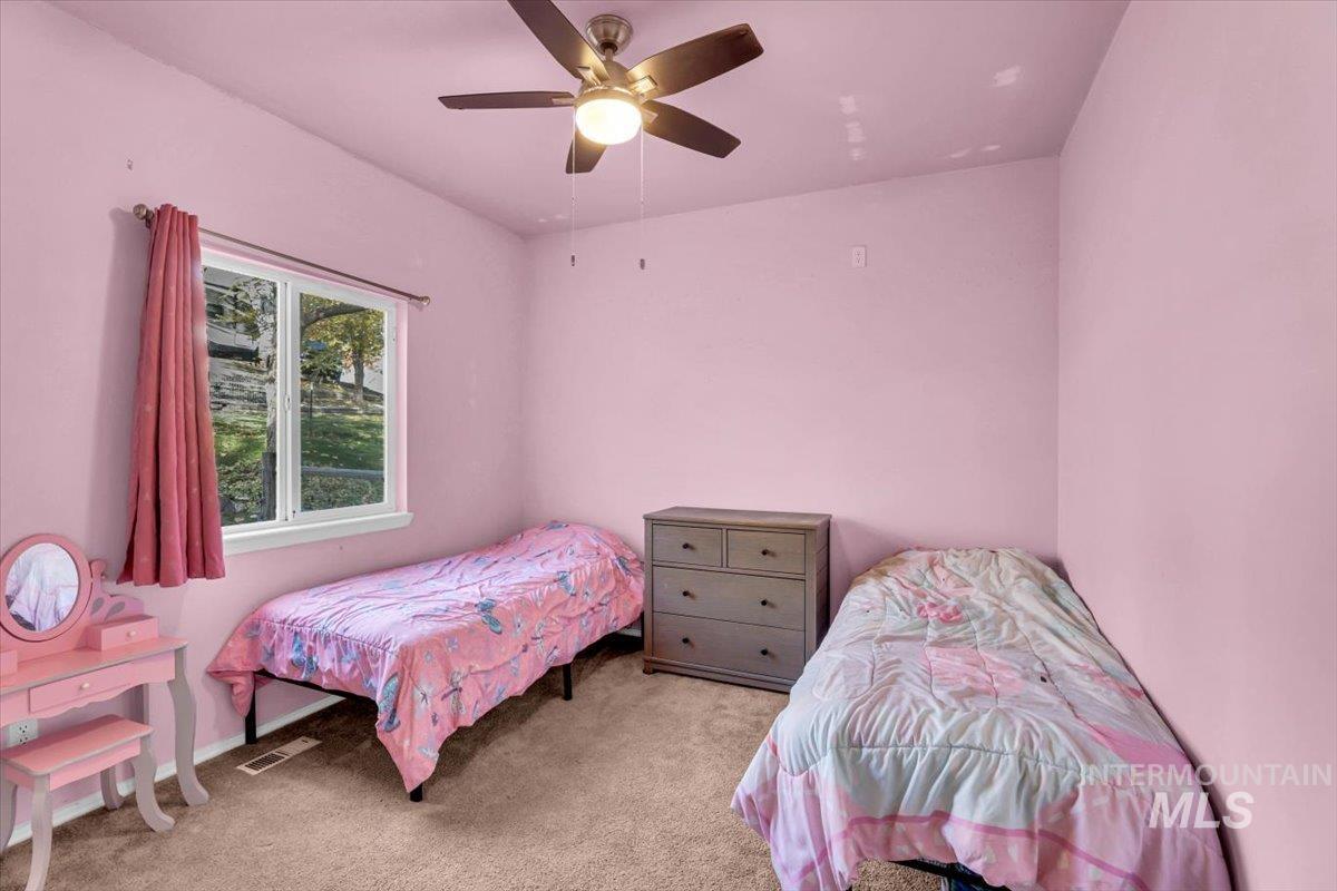 23919 Tyler Lane Middleton, ID 83644 - Photo 19 of 48 Bedroom with light colored carpet and ceiling fan