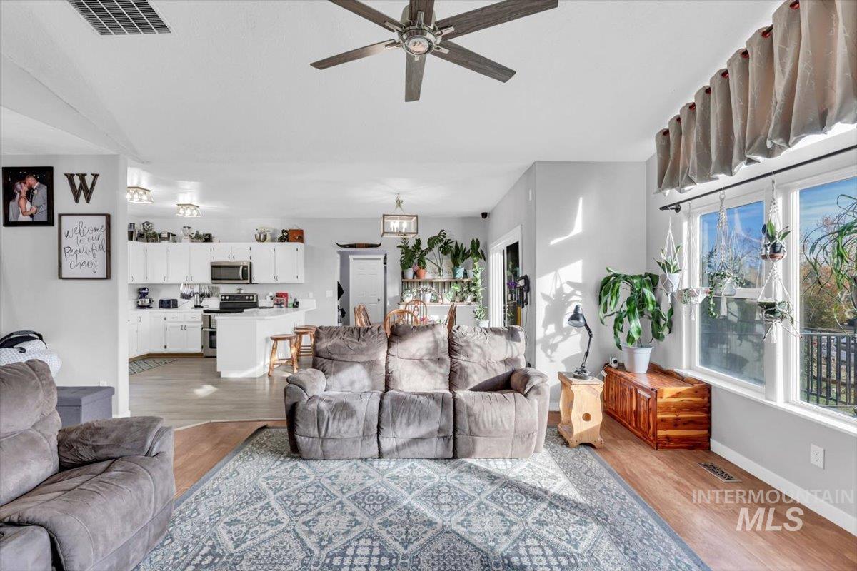 23919 Tyler Lane Middleton, ID 83644 - Photo 36 of 48 Living room featuring light wood-type flooring and ceiling fan
