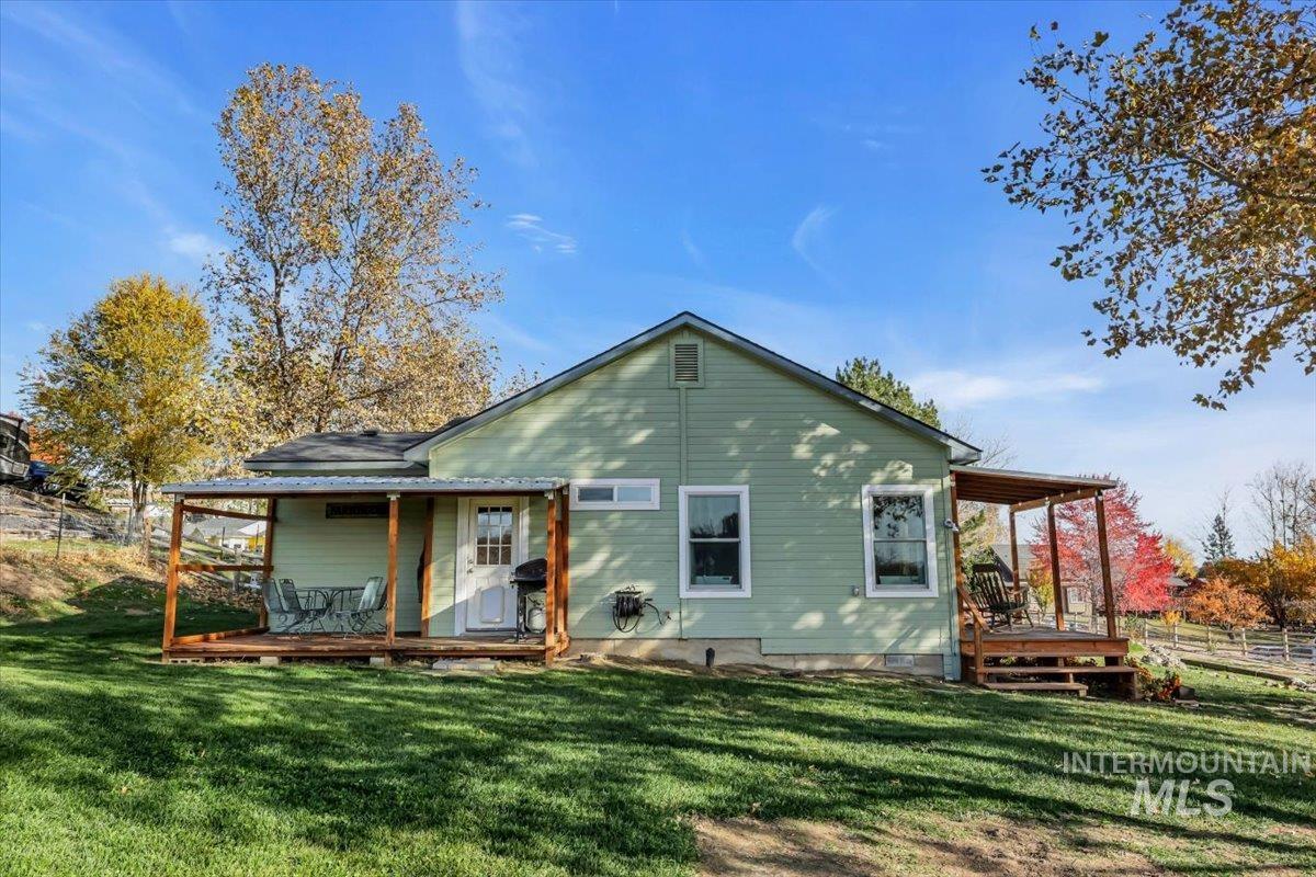 23919 Tyler Lane Middleton, ID 83644 - Photo 4 of 48 Rear view of house featuring a wooden deck