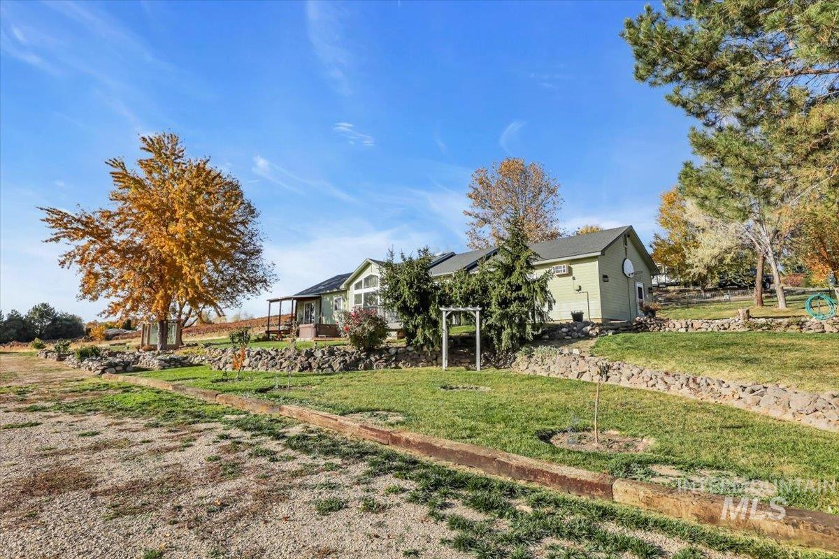 23919 Tyler Lane Middleton, ID 83644 - Photo 8 of 48 View of side of home with a lawn
