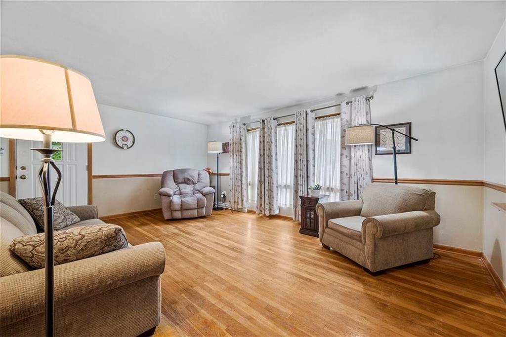328 Wallrose Heights Road Baden, PA 15005 - Photo 8 of 23 a living room with furniture and a large window