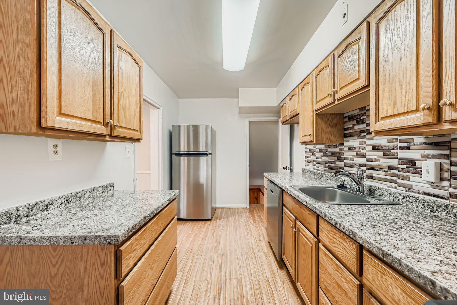 5466 Addington Road Baltimore, MD 21207 - Photo 14 of 31 Modern kitchen with stylish finishes.