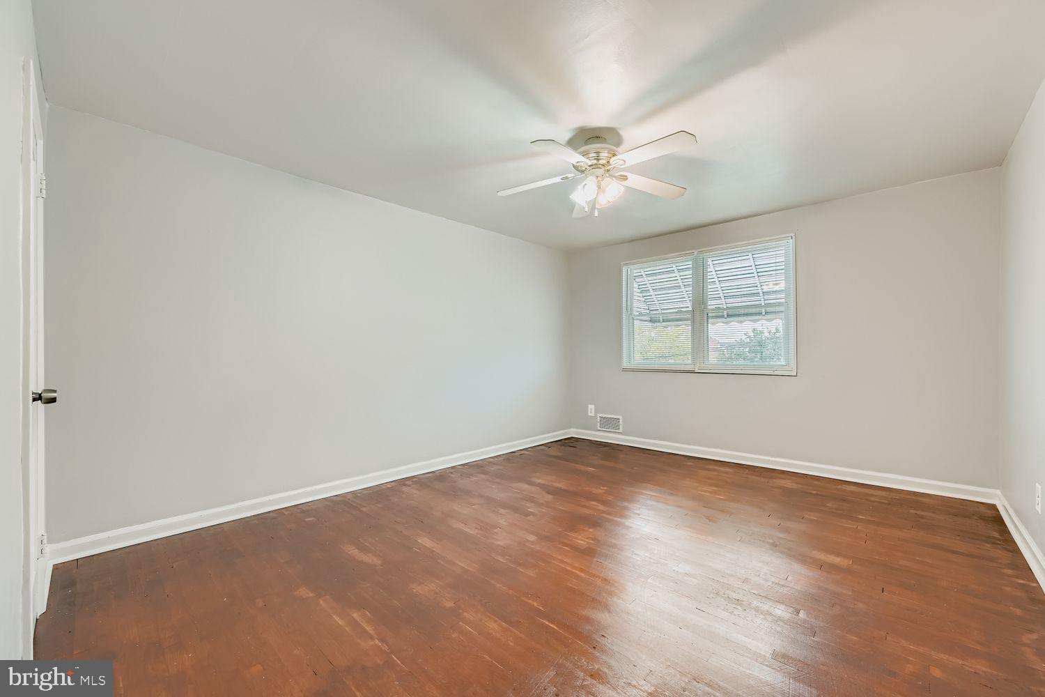 5466 Addington Road Baltimore, MD 21207 - Photo 16 of 31 Spacious room with natural light and charm.
