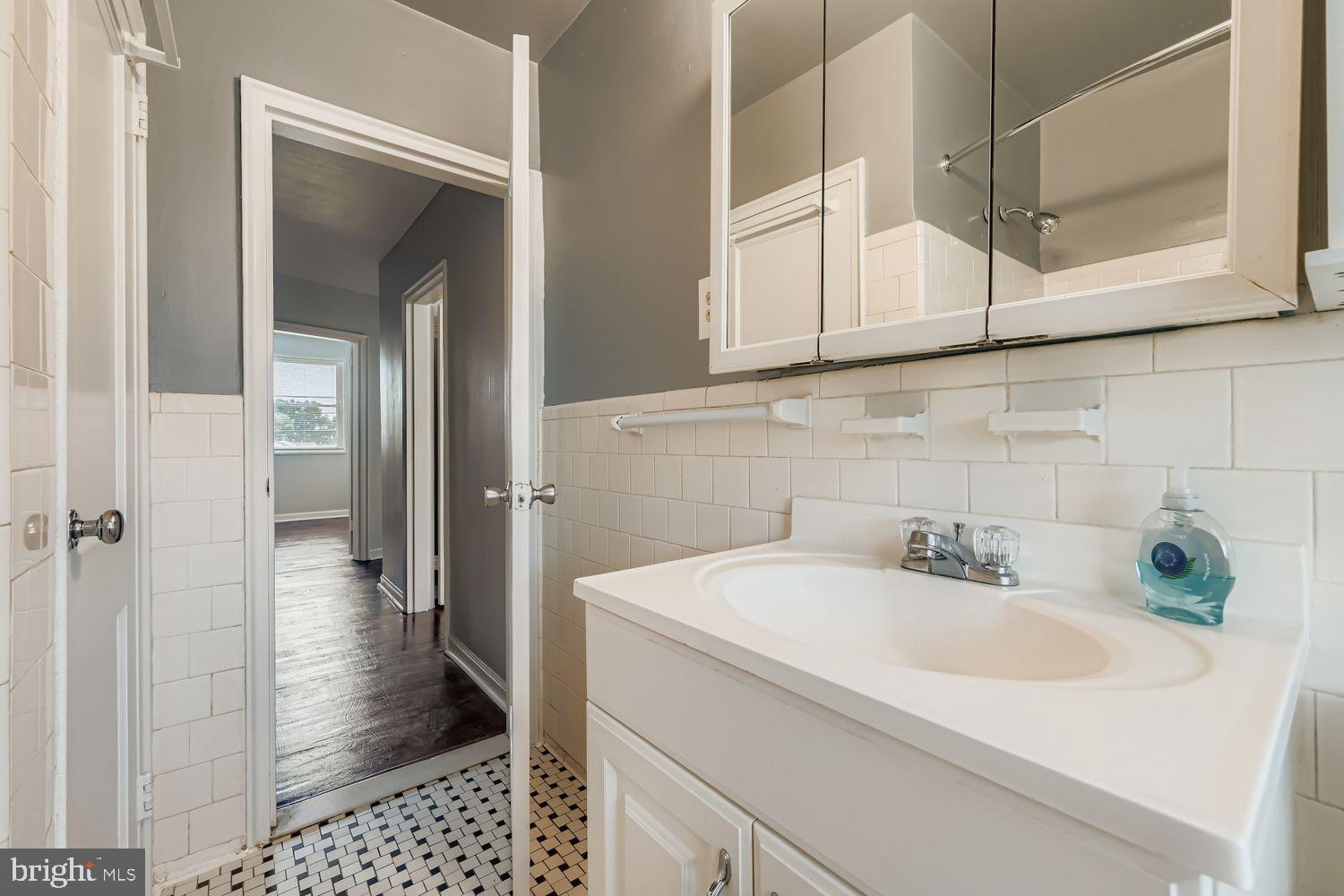 5466 Addington Road Baltimore, MD 21207 - Photo 19 of 31 Charming bathroom with classic tile accents.