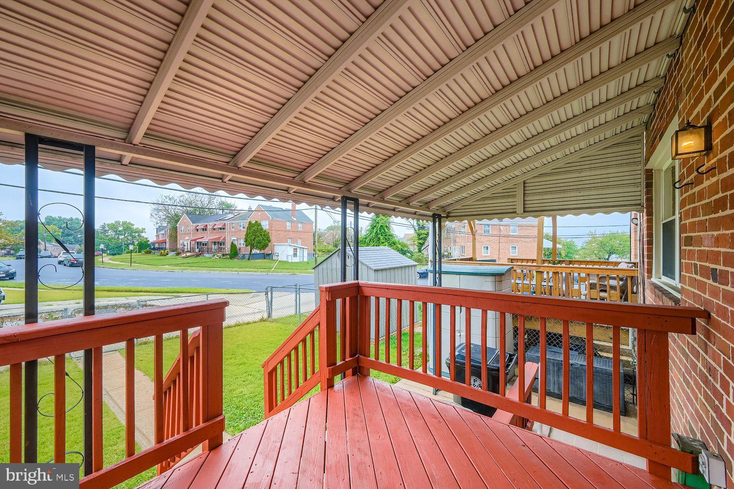 5466 Addington Road Baltimore, MD 21207 - Photo 29 of 31 Freshly stained covered porch with scenic views.