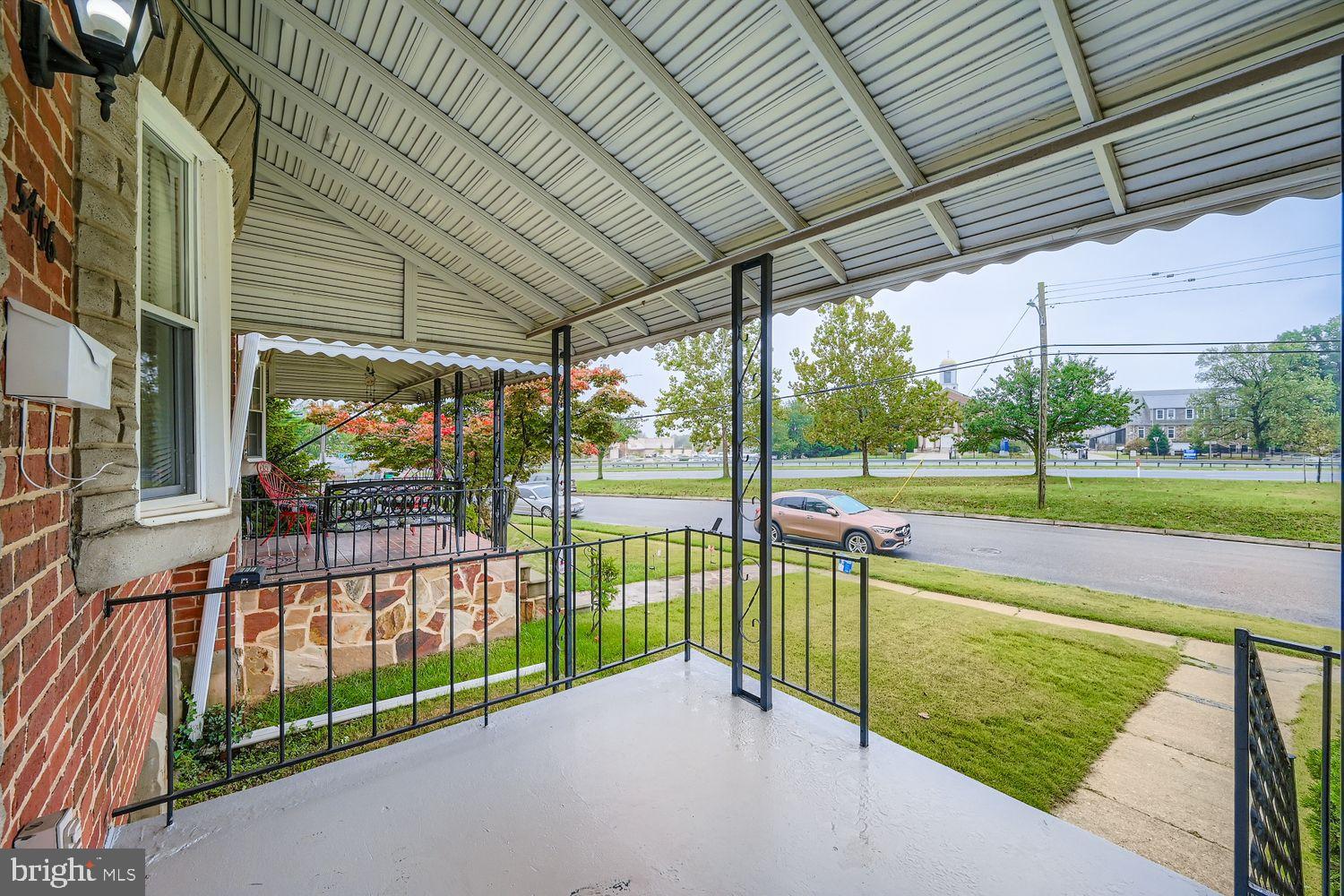 5466 Addington Road Baltimore, MD 21207 - Photo 3 of 31 Covered front porch with serene street views.