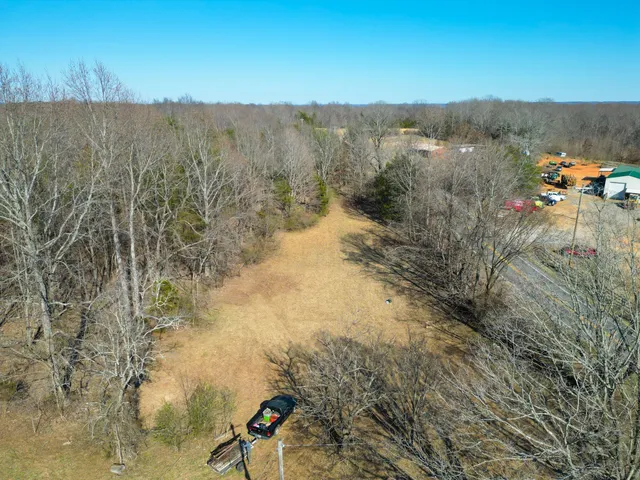 a backyard of a house with lots of trees