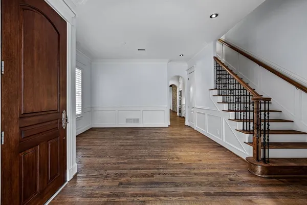 a view of entryway with wooden floor