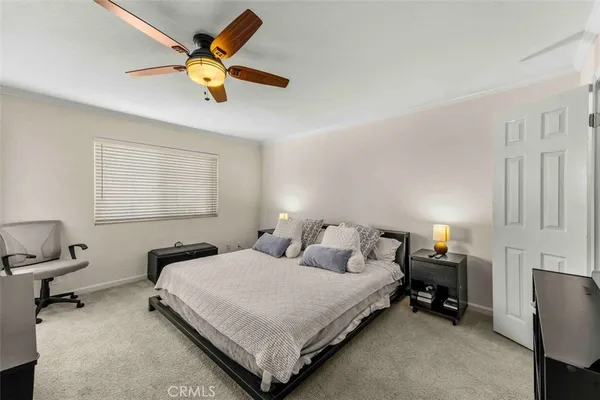 a bedroom with bed and window