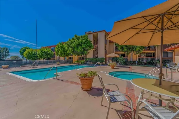 a view of a swimming pool with a patio