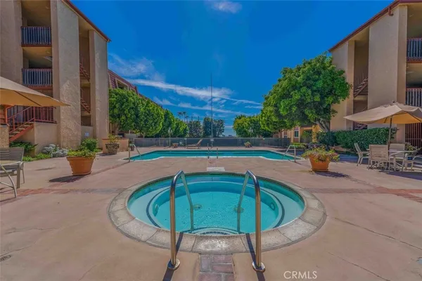a view of a swimming pool with a patio