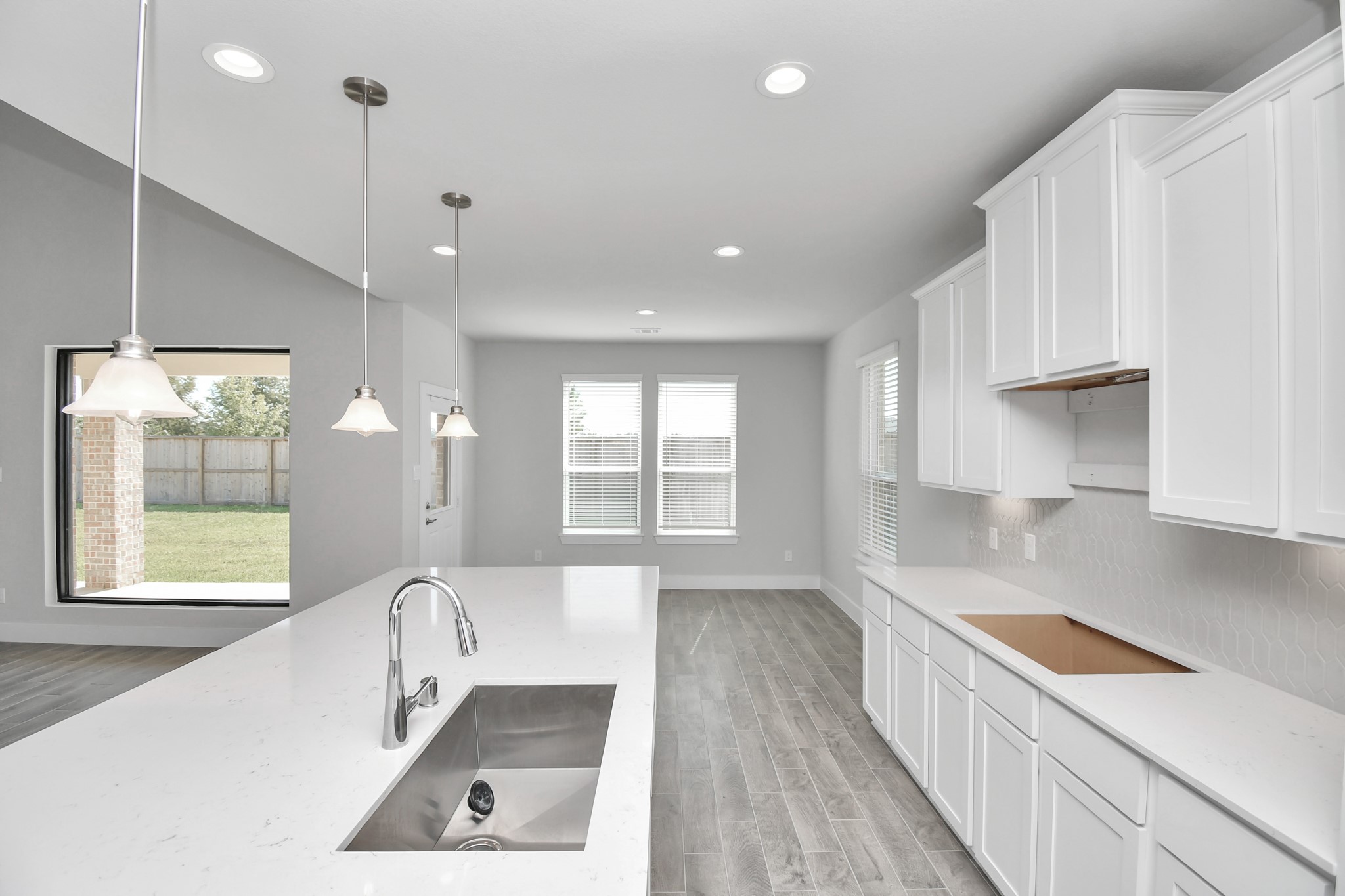 3103 Native Spg Drive Spring, TX 77373 - Photo 11 of 36 a large white kitchen with a large window
