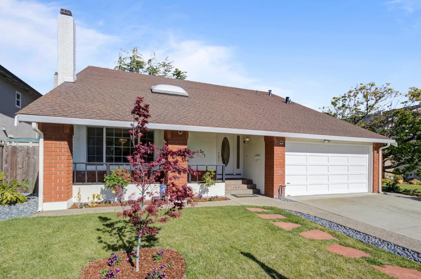 271 Spinnaker Street Foster City, CA 94404 - Photo 1 of 28 a front view of a house with a garden and patio