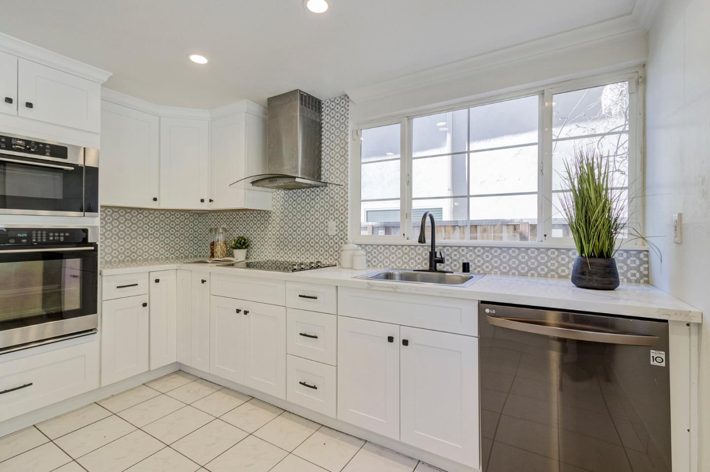 271 Spinnaker Street Foster City, CA 94404 - Photo 11 of 28 a kitchen with appliances a sink and cabinets