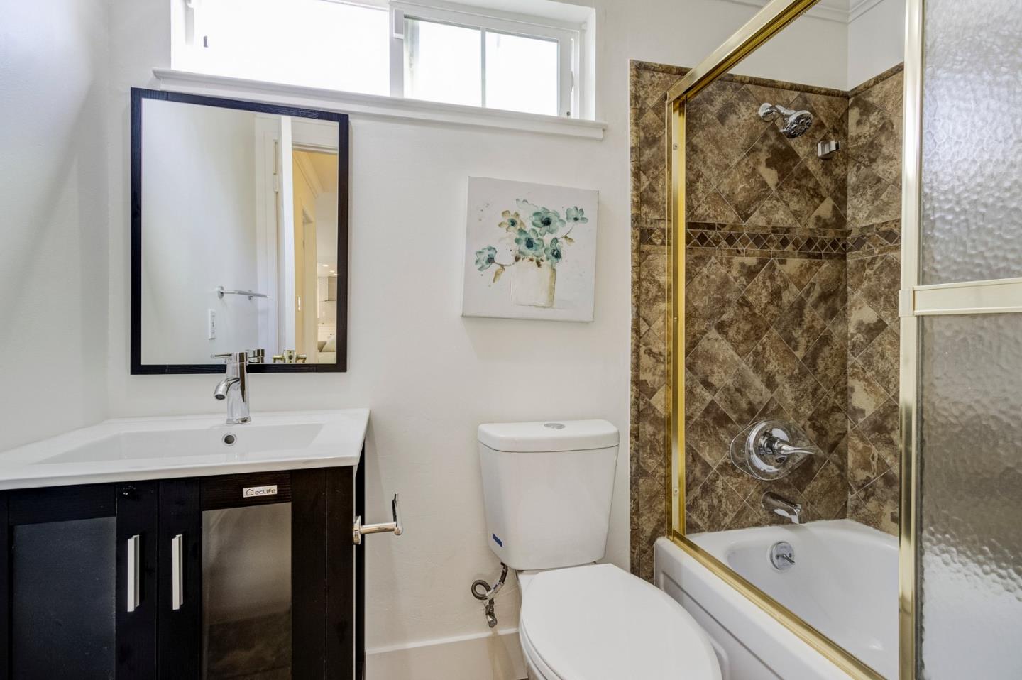 271 Spinnaker Street Foster City, CA 94404 - Photo 13 of 28 a bathroom with a sink toilet and shower