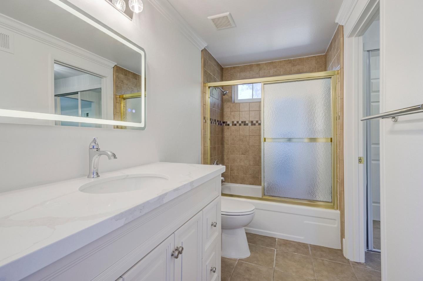 271 Spinnaker Street Foster City, CA 94404 - Photo 15 of 28 a bathroom with a sink a toilet and shower