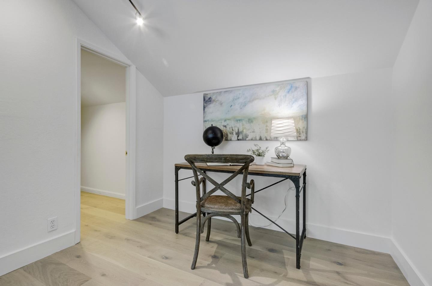 271 Spinnaker Street Foster City, CA 94404 - Photo 17 of 28 a view of a workspace area with table and wooden floor