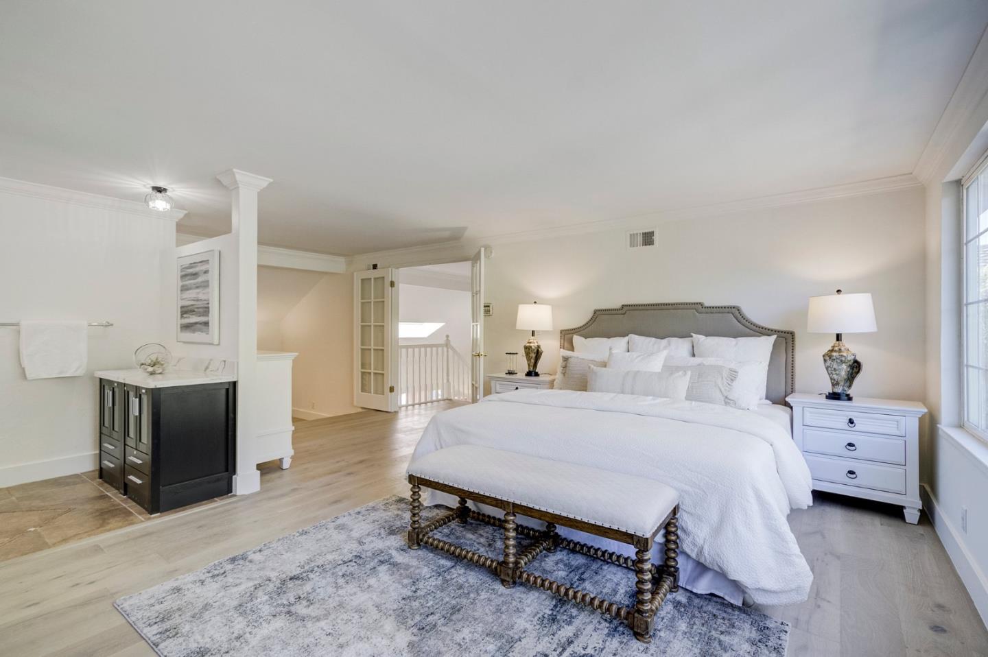271 Spinnaker Street Foster City, CA 94404 - Photo 19 of 28 a bedroom with a bed and a flat screen tv