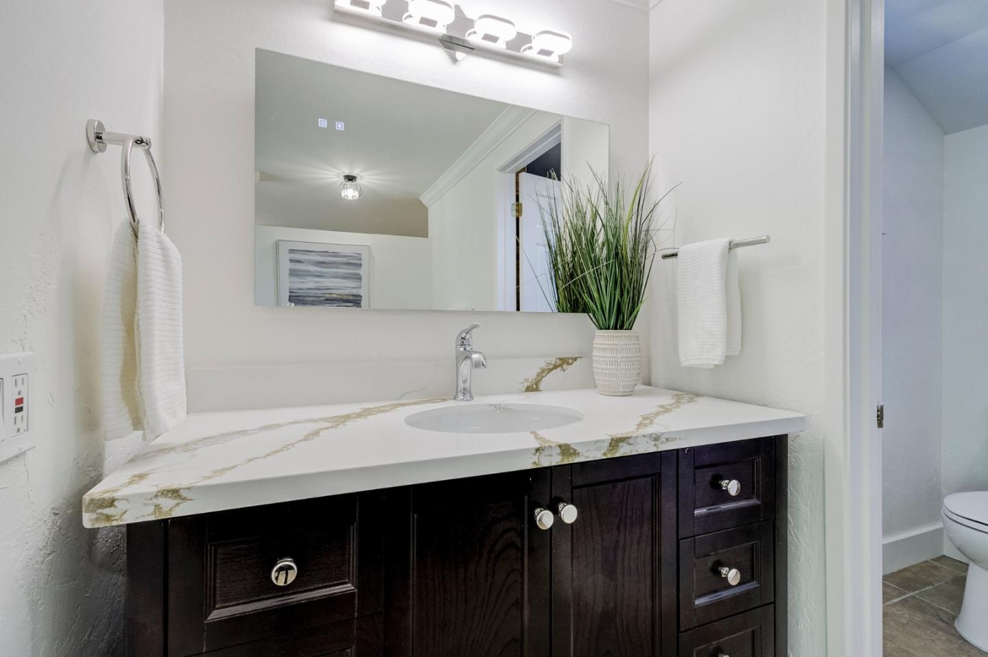 271 Spinnaker Street Foster City, CA 94404 - Photo 20 of 28 a bathroom with a sink a vanity and a mirror