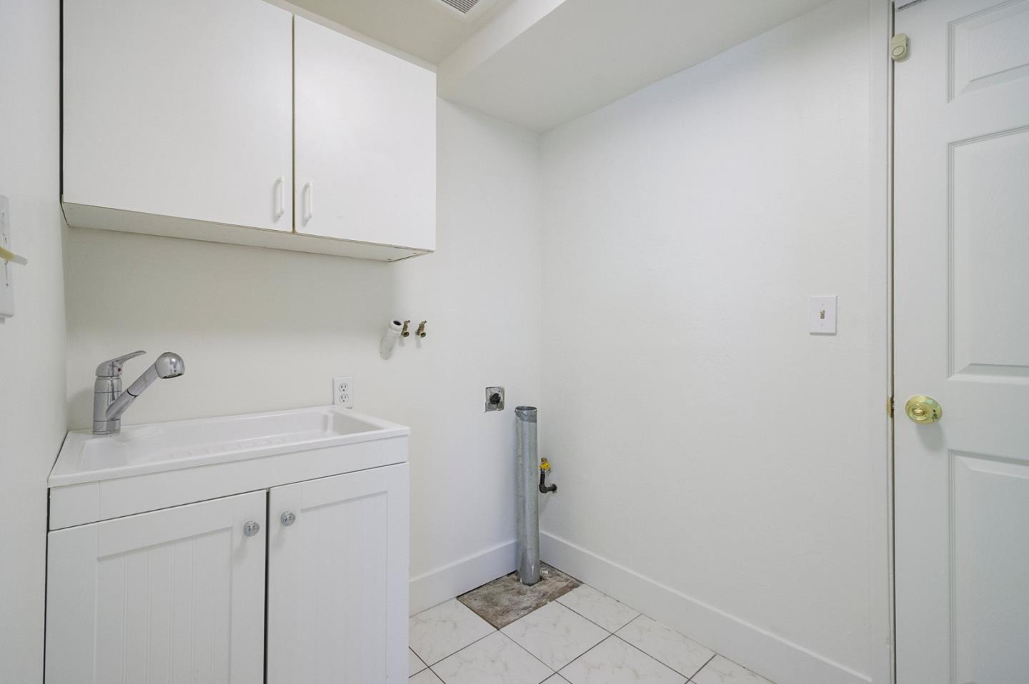 271 Spinnaker Street Foster City, CA 94404 - Photo 22 of 28 a bathroom with a sink and cabinets