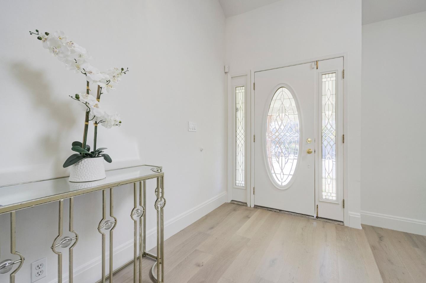 271 Spinnaker Street Foster City, CA 94404 - Photo 5 of 28 a view of a livingroom with wooden floor and window
