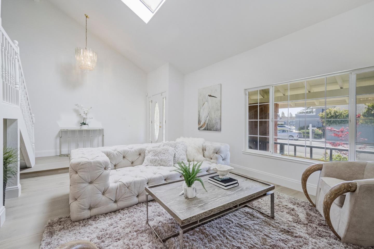 271 Spinnaker Street Foster City, CA 94404 - Photo 6 of 28 a living room with furniture and a large window