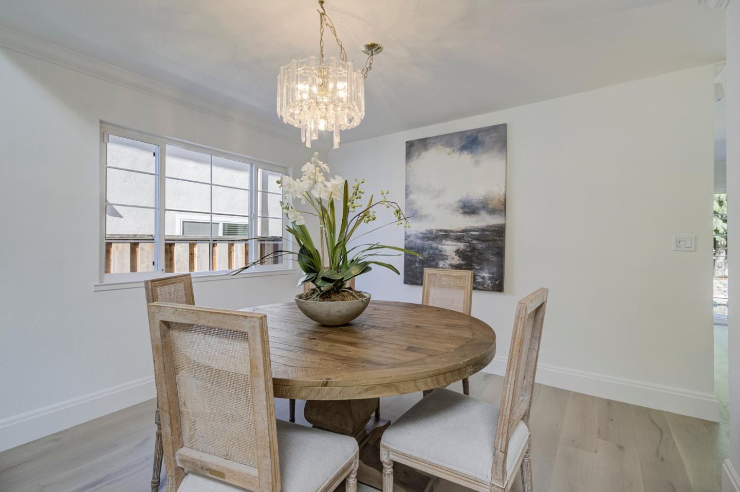 271 Spinnaker Street Foster City, CA 94404 - Photo 8 of 28 a view of a dining room with furniture a chandelier and wooden floor