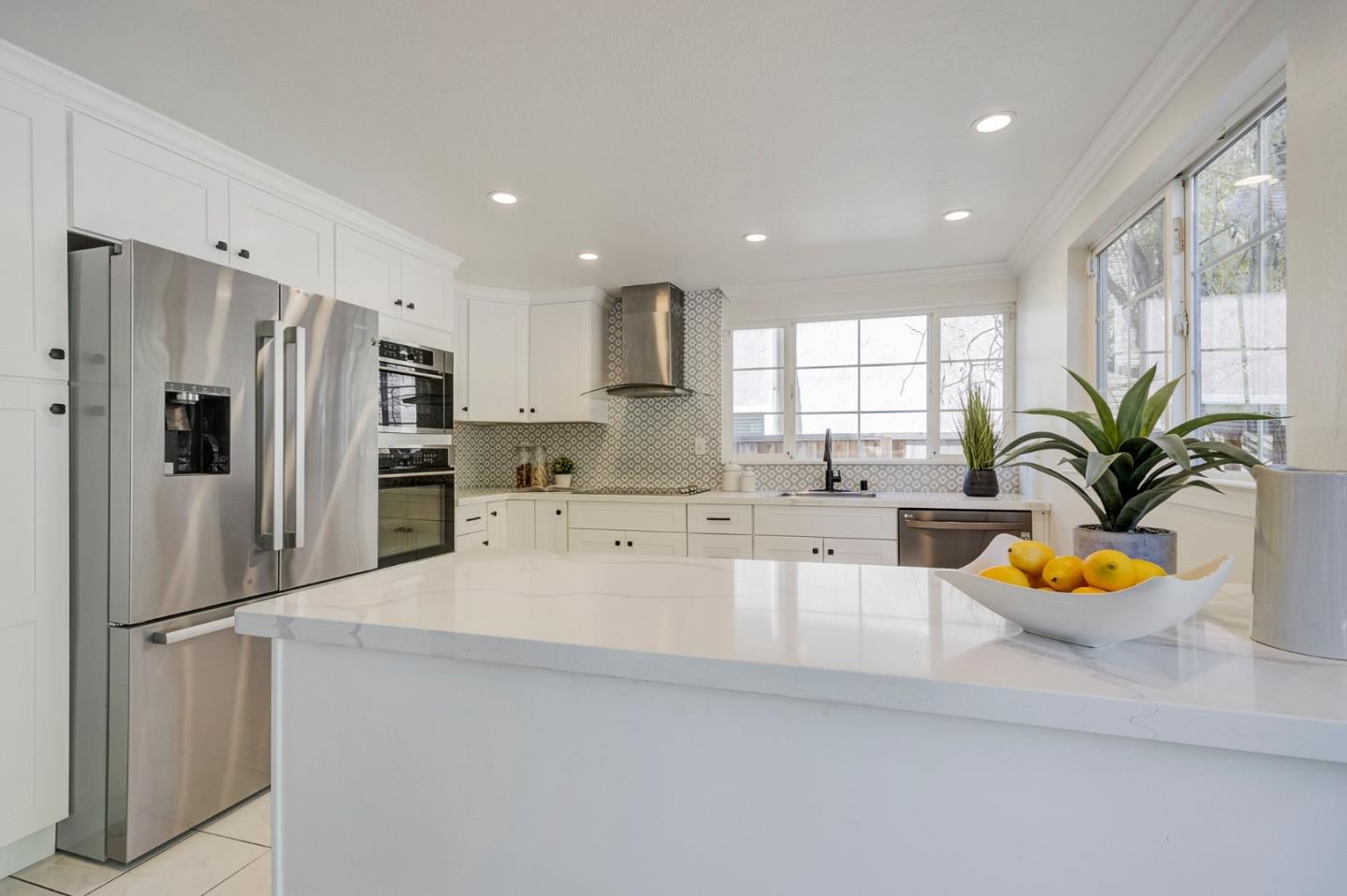 271 Spinnaker Street Foster City, CA 94404 - Photo 9 of 28 a large kitchen with granite countertop a refrigerator and a sink