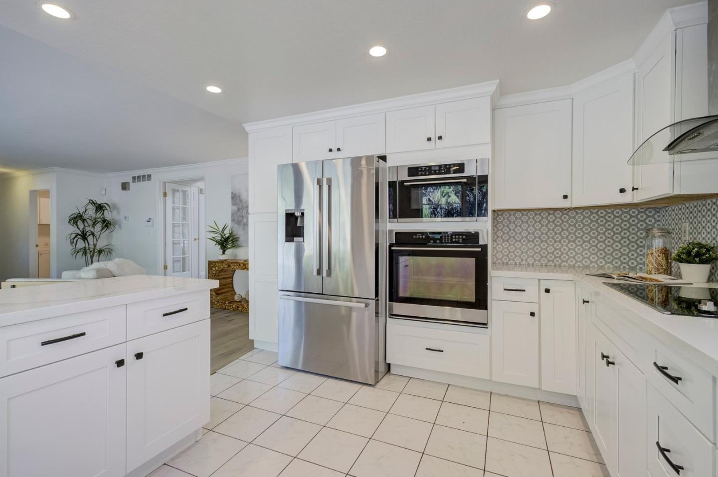271 Spinnaker Street Foster City, CA 94404 - Photo 10 of 28 a kitchen with white cabinets white appliances and sink