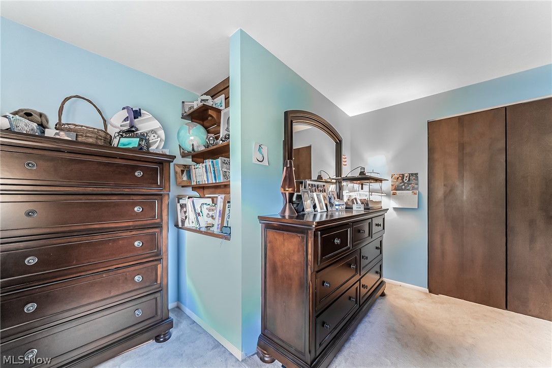 16775 Snyder Road Chagrin Falls, OH 44023 - Photo 17 of 31 Bedroom with light carpet and a closet