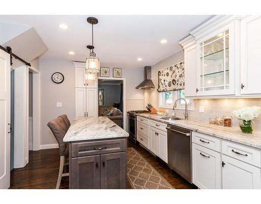 72 Badger Road Medford, MA 02155 - Photo 14 of 42 a kitchen with stainless steel appliances granite countertop a sink stove and refrigerator