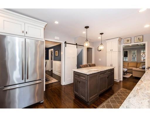 72 Badger Road Medford, MA 02155 - Photo 16 of 42 a kitchen with stainless steel appliances granite countertop a refrigerator a stove and a sink