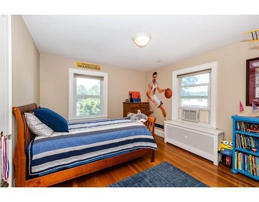 72 Badger Road Medford, MA 02155 - Photo 21 of 42 a living room with furniture a window and bookshelf