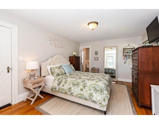 72 Badger Road Medford, MA 02155 - Photo 27 of 42 a bedroom with a bed and a flat screen tv