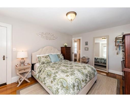 72 Badger Road Medford, MA 02155 - Photo 28 of 42 a bedroom with a bed and wooden floor