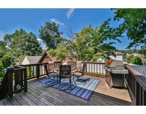 72 Badger Road Medford, MA 02155 - Photo 38 of 42 a view of a chairs and table on the wooden deck