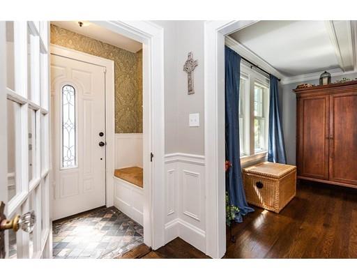 72 Badger Road Medford, MA 02155 - Photo 6 of 42 a view of a hallway with windows and chandelier