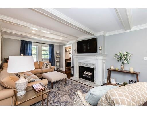 72 Badger Road Medford, MA 02155 - Photo 10 of 42 a bedroom with a bed large window and a fireplace