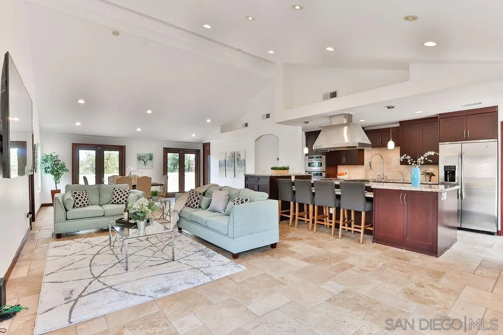 2038 Valley Rim Road El Cajon, CA 92019 - Photo 1 of 37 a living room with lots of furniture and kitchen view