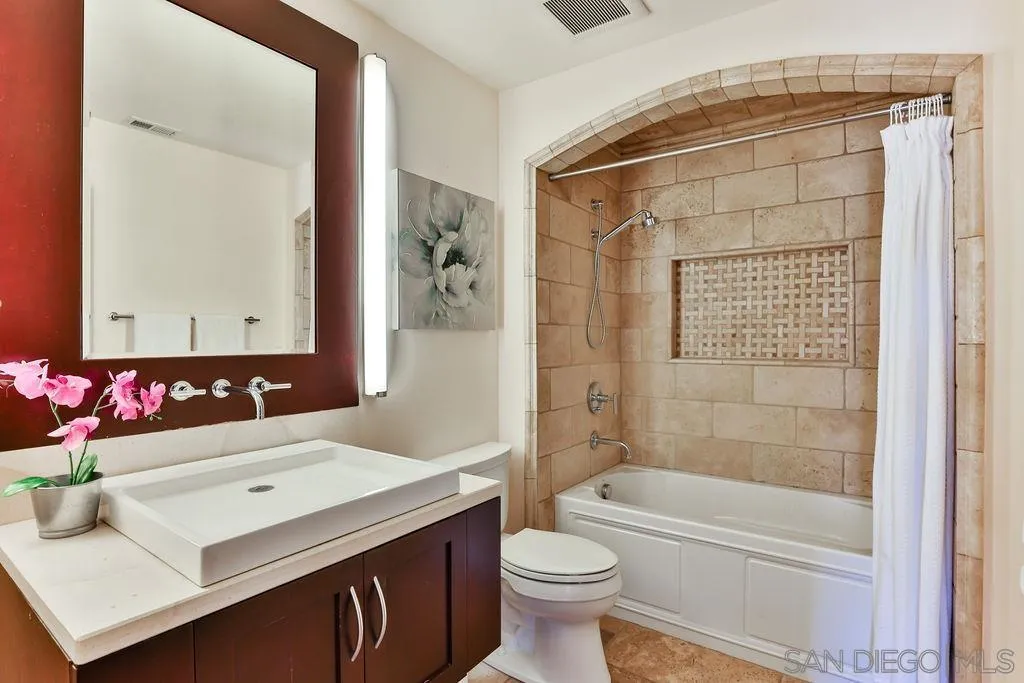 2038 Valley Rim Road El Cajon, CA 92019 - Photo 12 of 37 a bathroom with a sink toilet vanity and shower